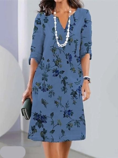Model styled in floral print tunic dress with sandals for a casual summer look