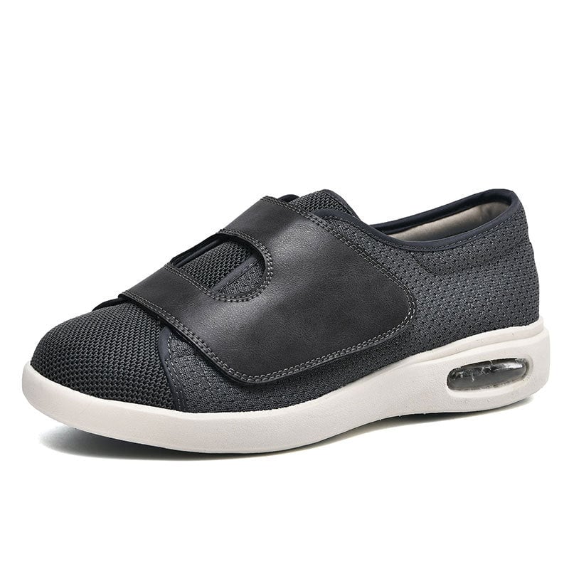 Side profile of women's wide fit knit sneaker highlighting the adjustable hook-and-loop strap closure