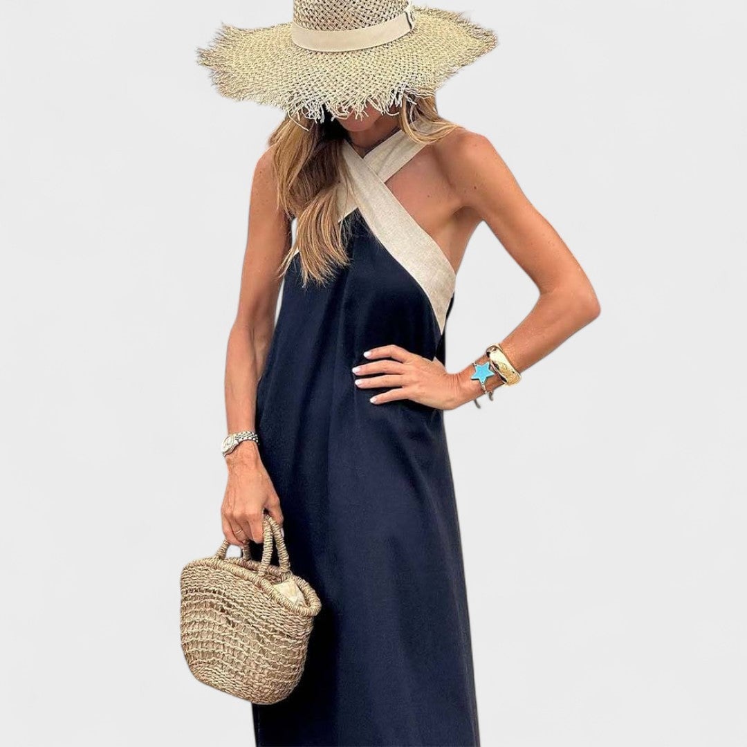 Close-up of the crisscross neckline on a white lightweight maxi dress