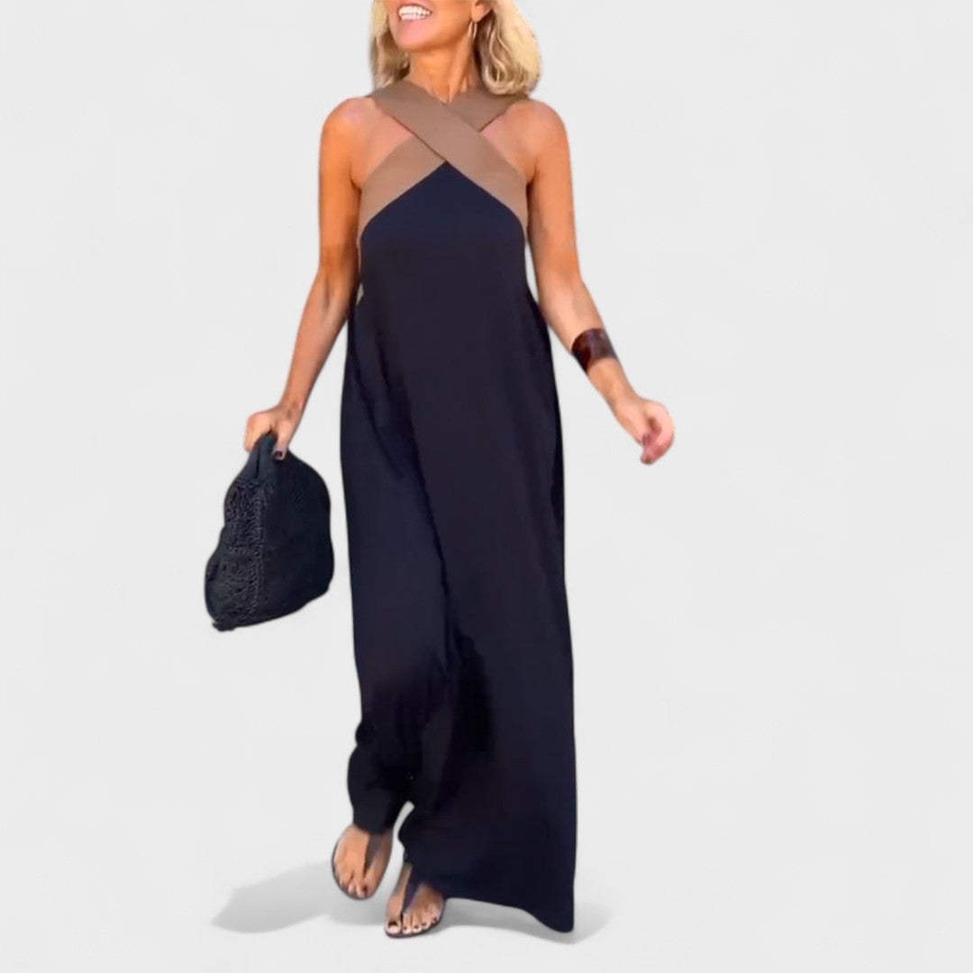 Back view of the elegant cross-neck maxi dress in black showing the open neckline detail