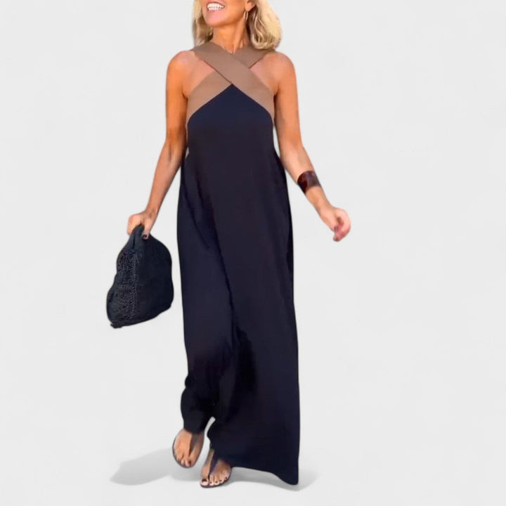 Back view of the elegant cross-neck maxi dress in black showing the open neckline detail