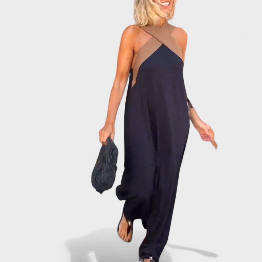 Close-up of the lightweight fabric of the flowing maxi dress in white