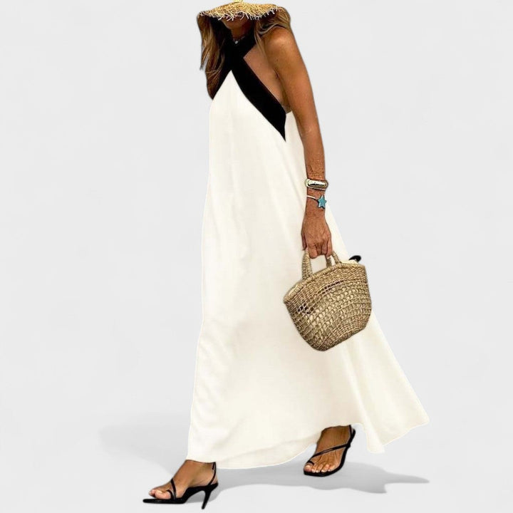 Flat lay of the elegant cross-neck maxi dress in all three colors: black, navy blue, and white