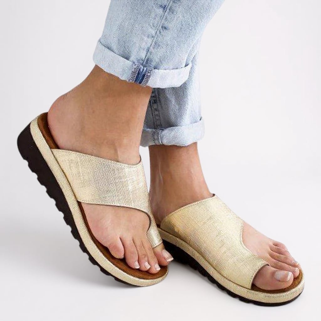 Close-up of the Suki sandal's shock-absorbing sole and toe separator detail