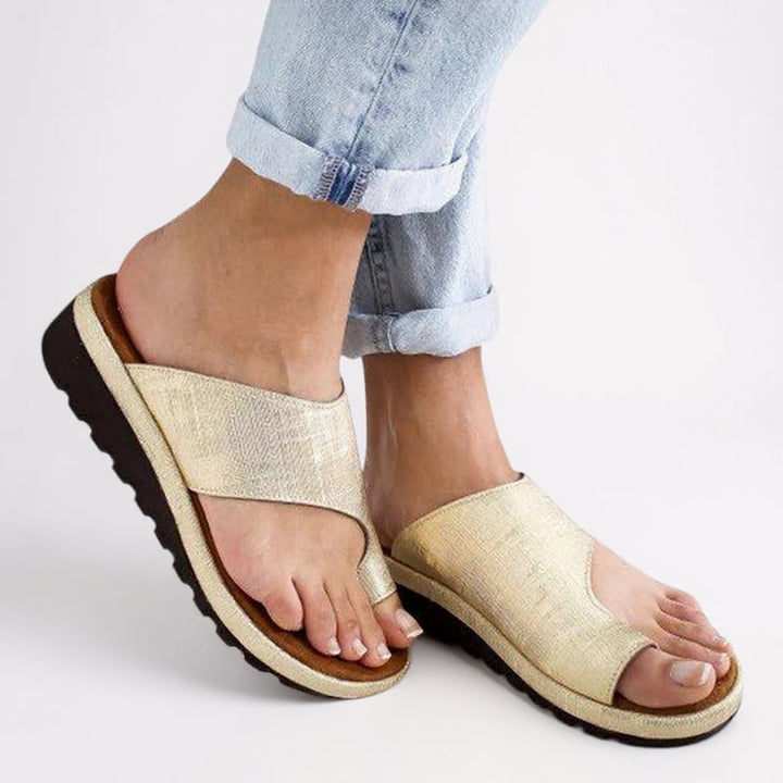Close-up of the Suki sandal's shock-absorbing sole and toe separator detail