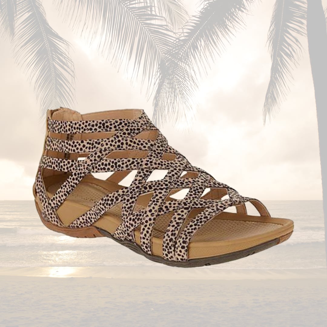 Women wearing orthopedic adjustable sandals in gray with denim shorts