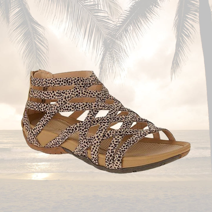 Women wearing orthopedic adjustable sandals in gray with denim shorts