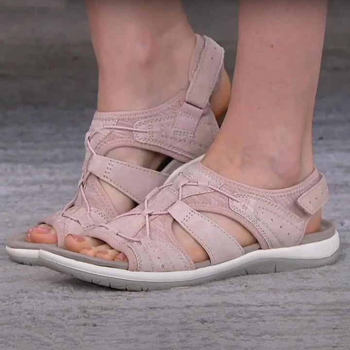 Women's orthopedic sandals in pink on a light background