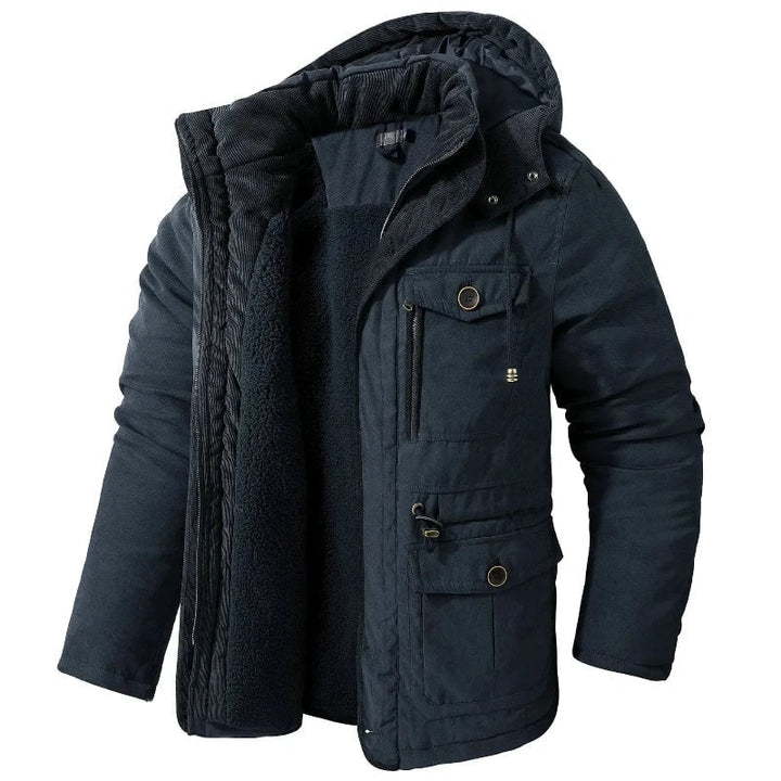 Close-up of adjustable cuffs and waterproof exterior on the Summit Winter Jacket in blue