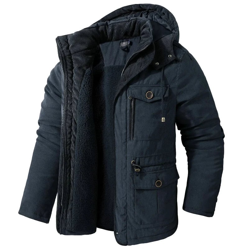 Close-up of adjustable cuffs and waterproof exterior on the Summit Winter Jacket in blue