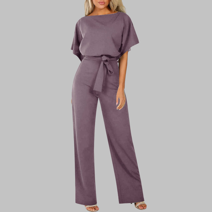 Flat lay of the Sunny wide-leg jumpsuit in army green displaying the batwing sleeves and self-tie belt