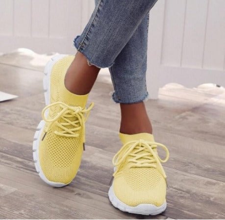 Women's Sunny knit lace-up sneaker in bold yellow with a clean white rubber sole on a white background