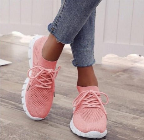 Pair of Sunny knit sneakers in red and pink colorways displayed together on a light surface