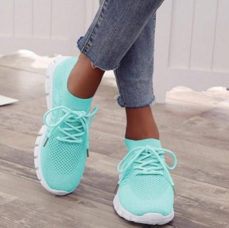 Close-up of the Sunny sneaker's flexible white rubber sole and lace-up front detail
