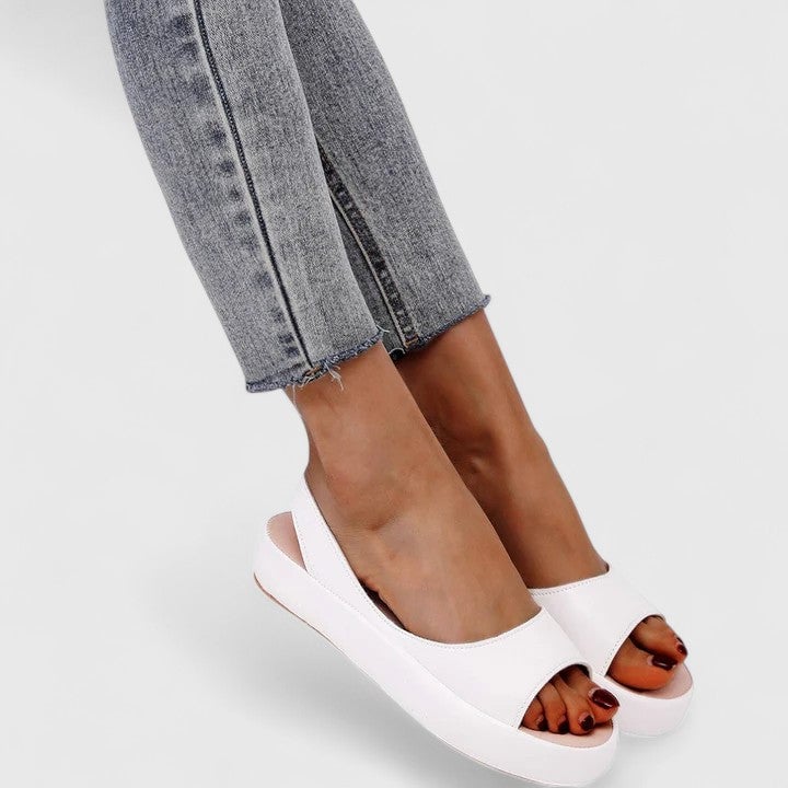 Sunny platform wedge sandal in orange, side profile view