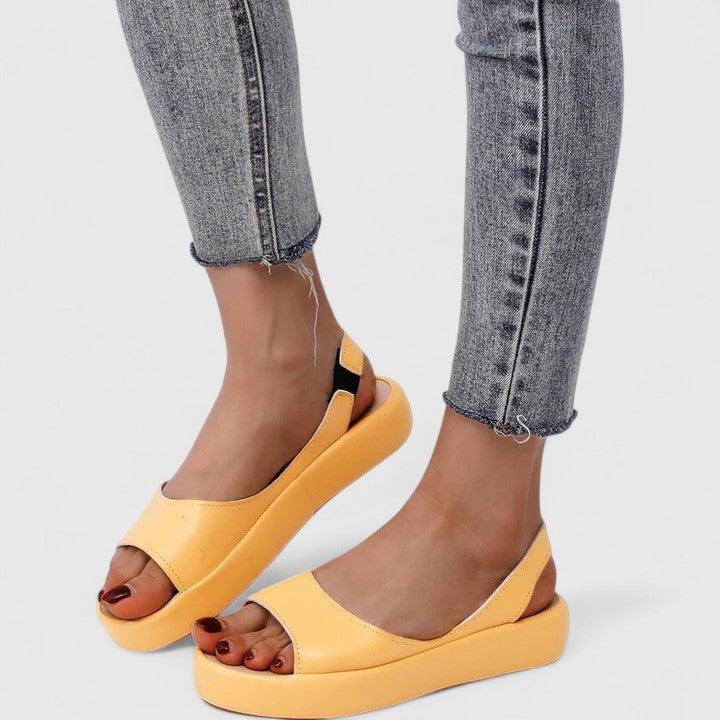 Sunny platform wedge slingback sandals styled with a summer outfit, all color options shown