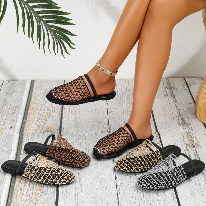 Suzette women's sandal in black, side profile showing cushioned insole
