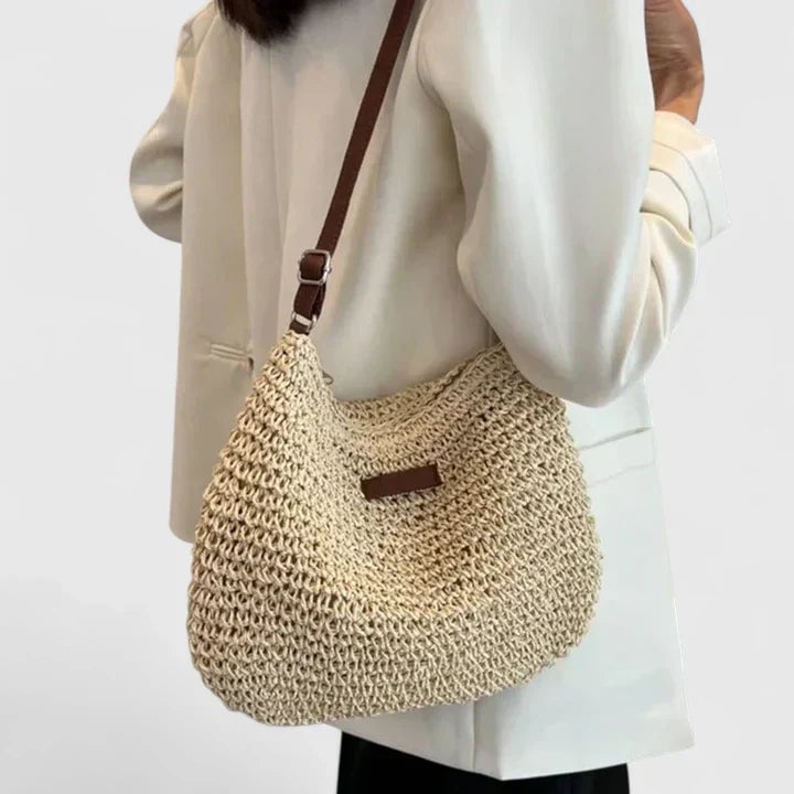 Side view of the natural shoulder bag showing depth and structure in khaki
