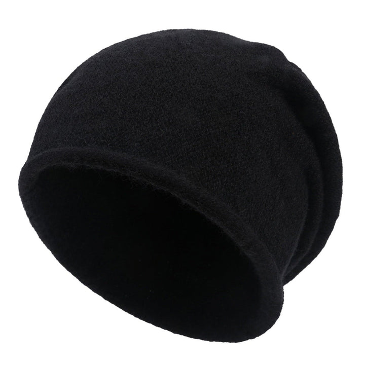 Sylvaine beanie in pale pink styled with a casual winter outfit
