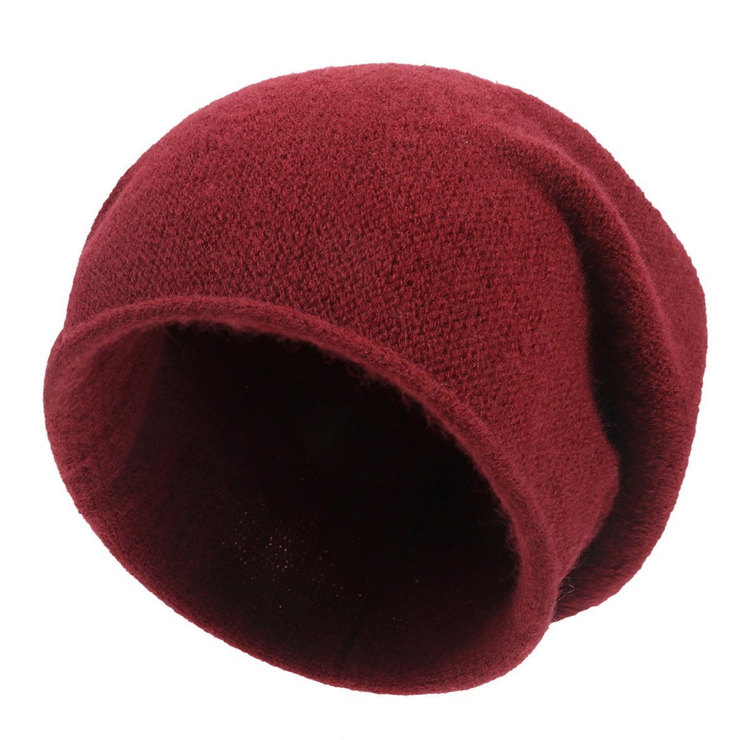 Sylvaine beanie in claret shown from a side angle highlighting the relaxed fit