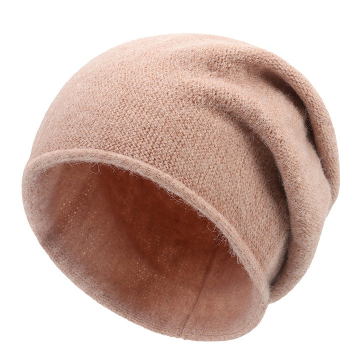 Sylvaine beanie in dark gray laid flat showing its lightweight packable design