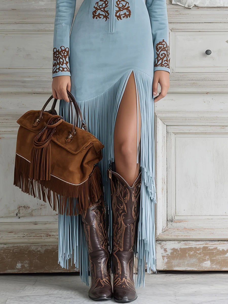 Side profile of a woman wearing the suede fringe maxi dress in light brown, showcasing the elongated curve-flattering silhouette