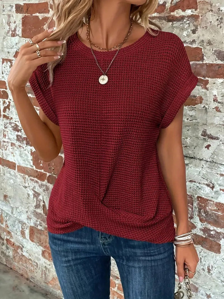 Cream white waffle knit casual tee with front twist on female model