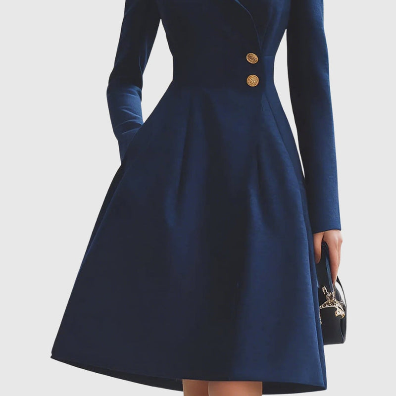 Styled shot of the Talia navy blue coat dress layered open as a chic coat over a coordinating outfit
