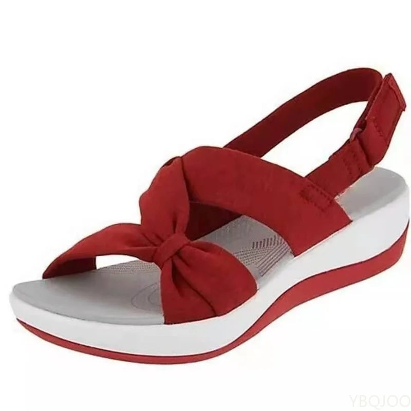 Talia women's sandal in red on a neutral background highlighting the shock-absorbing sole
