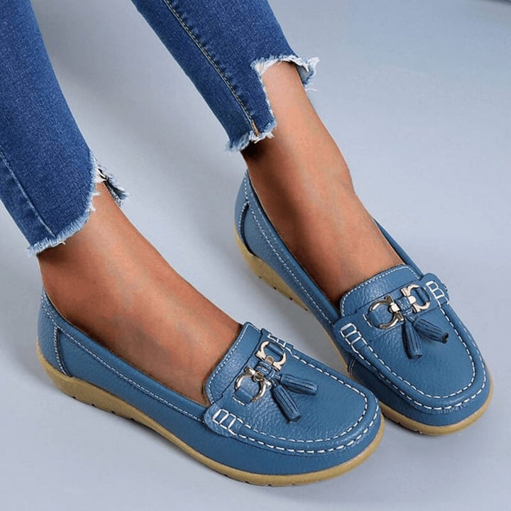 Talia tassel loafers in light blue with gold hardware and contrast white topstitching, front view