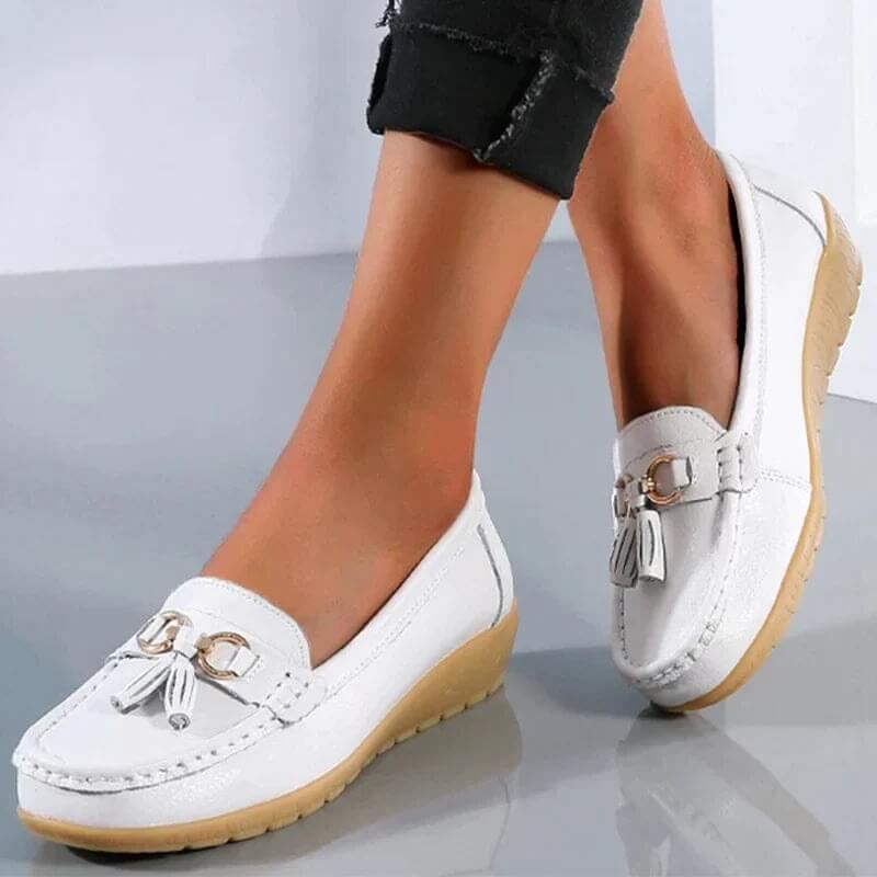 Talia tassel loafers in yellow, side view highlighting the structured upper and tassel detail