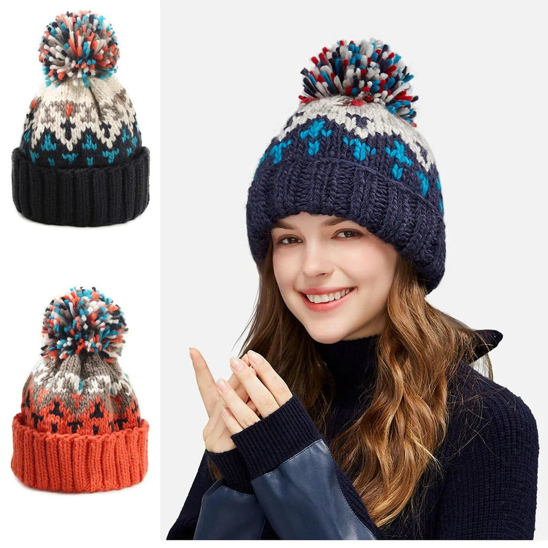 Flat lay of all five snowflake pom beanie color options side by side