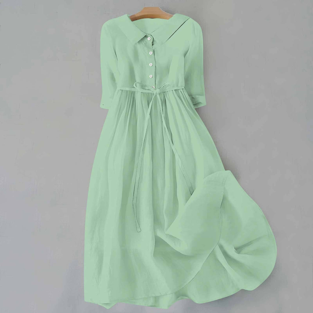 Tammie casual dress in light green shown from the side to highlight the clean minimalist silhouette