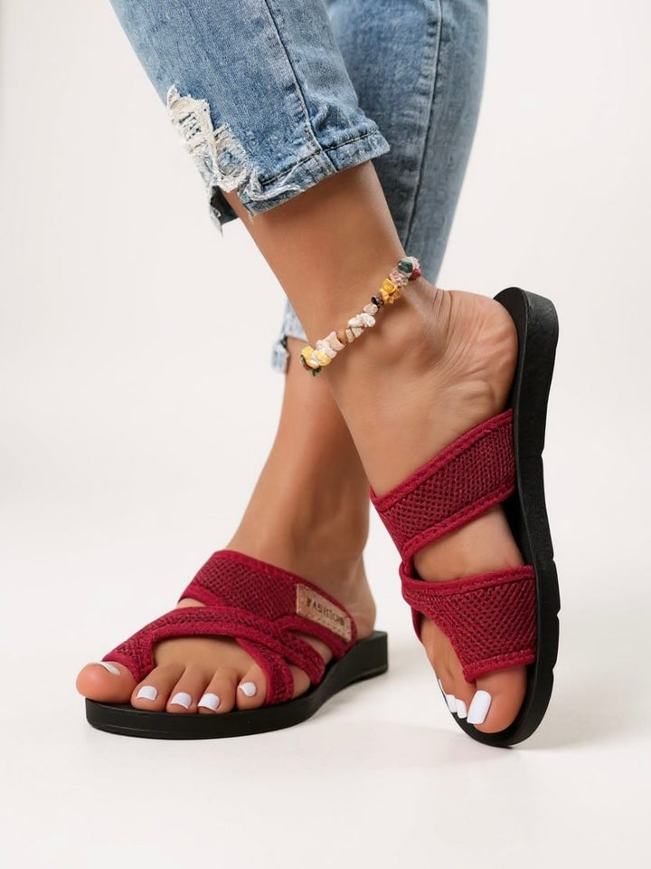 Tamsin cushioned slides in red flat lay on neutral background, showing full shoe shape