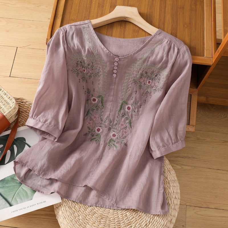 Floral embroidered blouse in beige with loose sleeves, styled with high-waisted pants