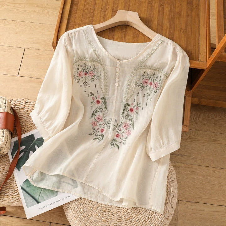 Pink floral relaxed blouse with classic button V-neckline, full-length model shot