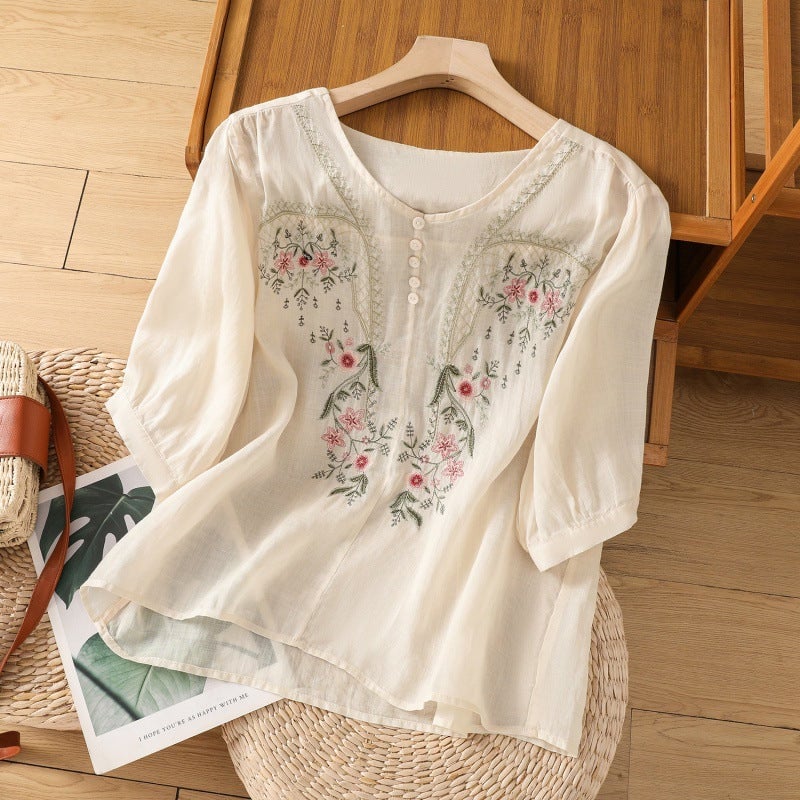 Pink floral relaxed blouse with classic button V-neckline, full-length model shot