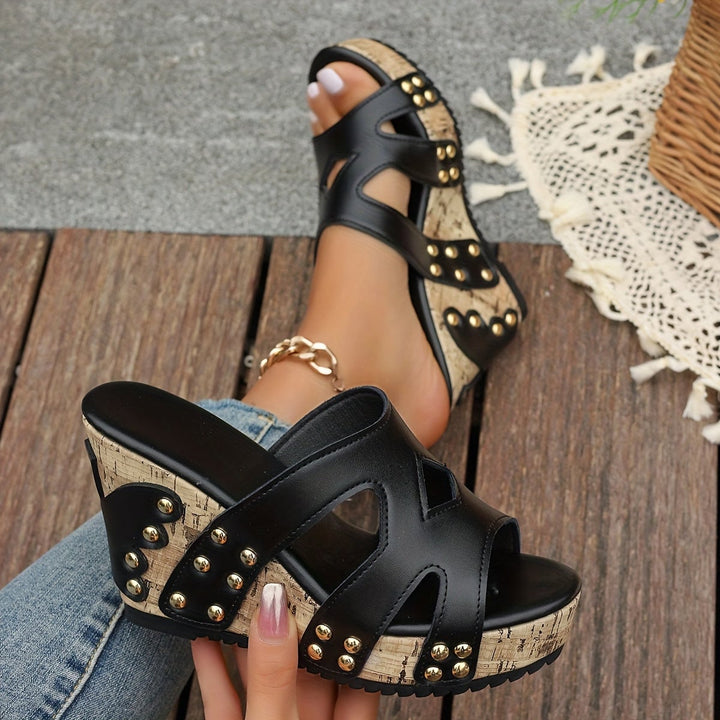 Tansy women's studded wedge sandals in black, side profile view