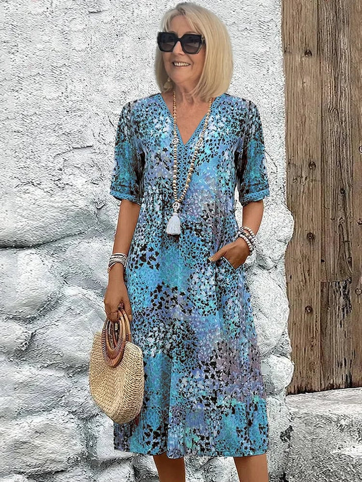 Front view of the Tanya midi dress showing the eye-catching colorful print and relaxed fit