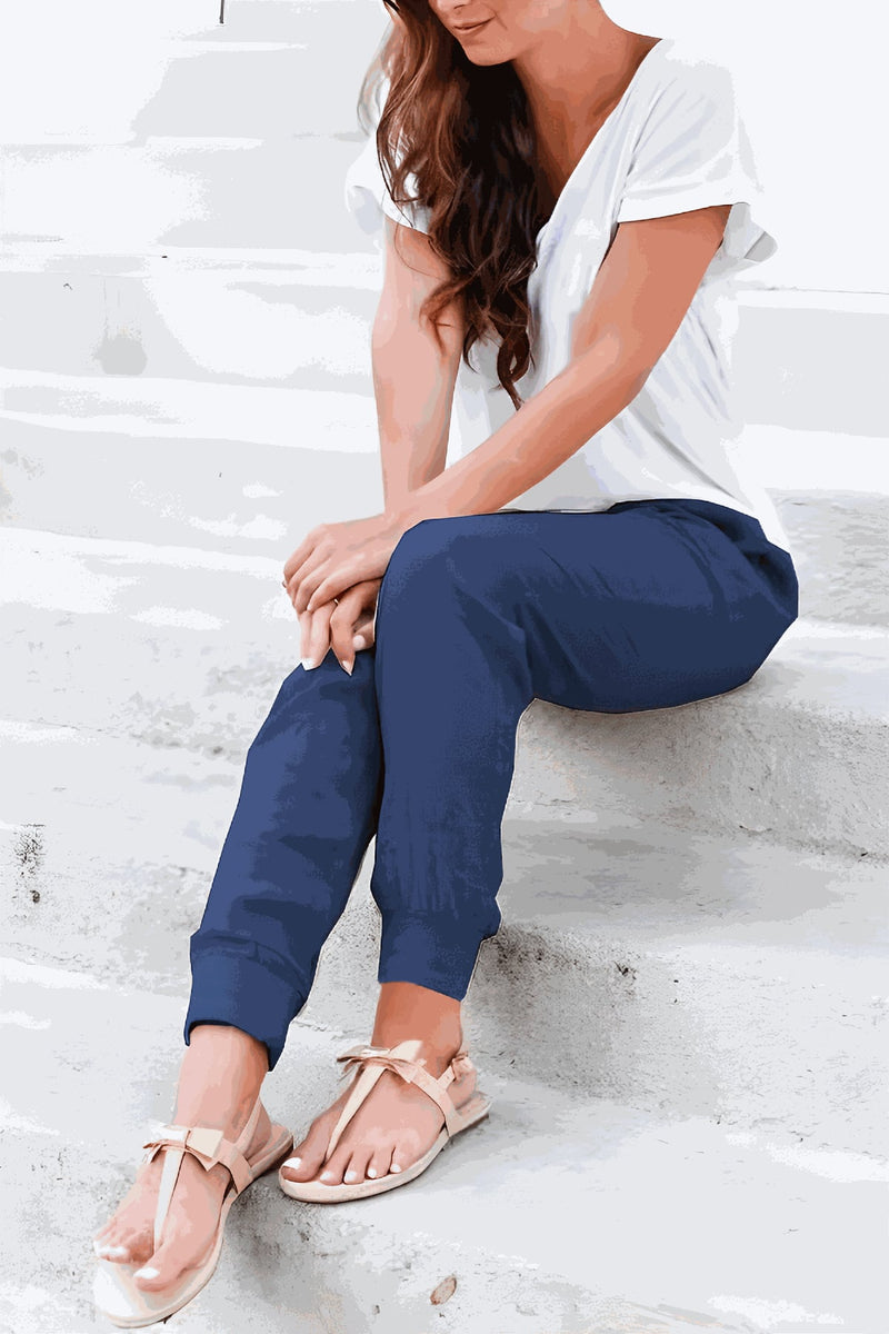 Women's black tapered jogger pants with drawstring waist, front view