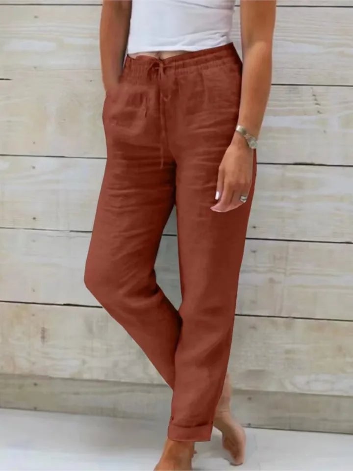 Women's turquoise drawstring jogger pants with elastic waistband, front view