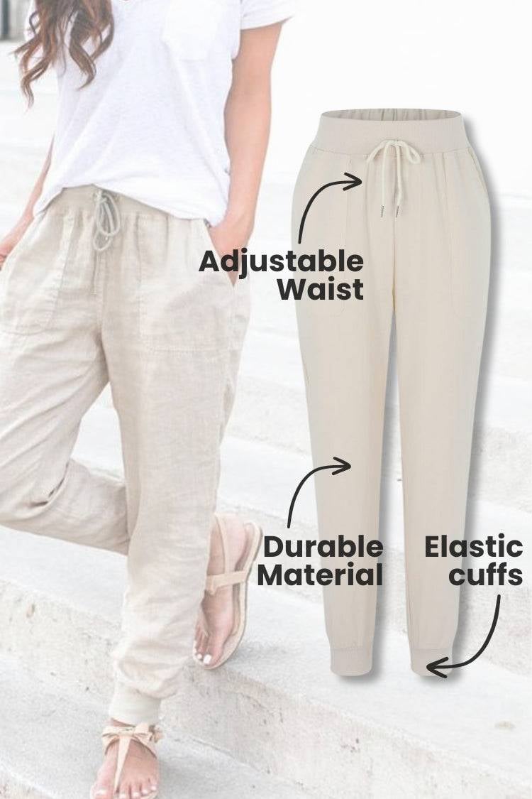 Women's navy blue tapered jogger pants with elastic ankle cuffs, front view
