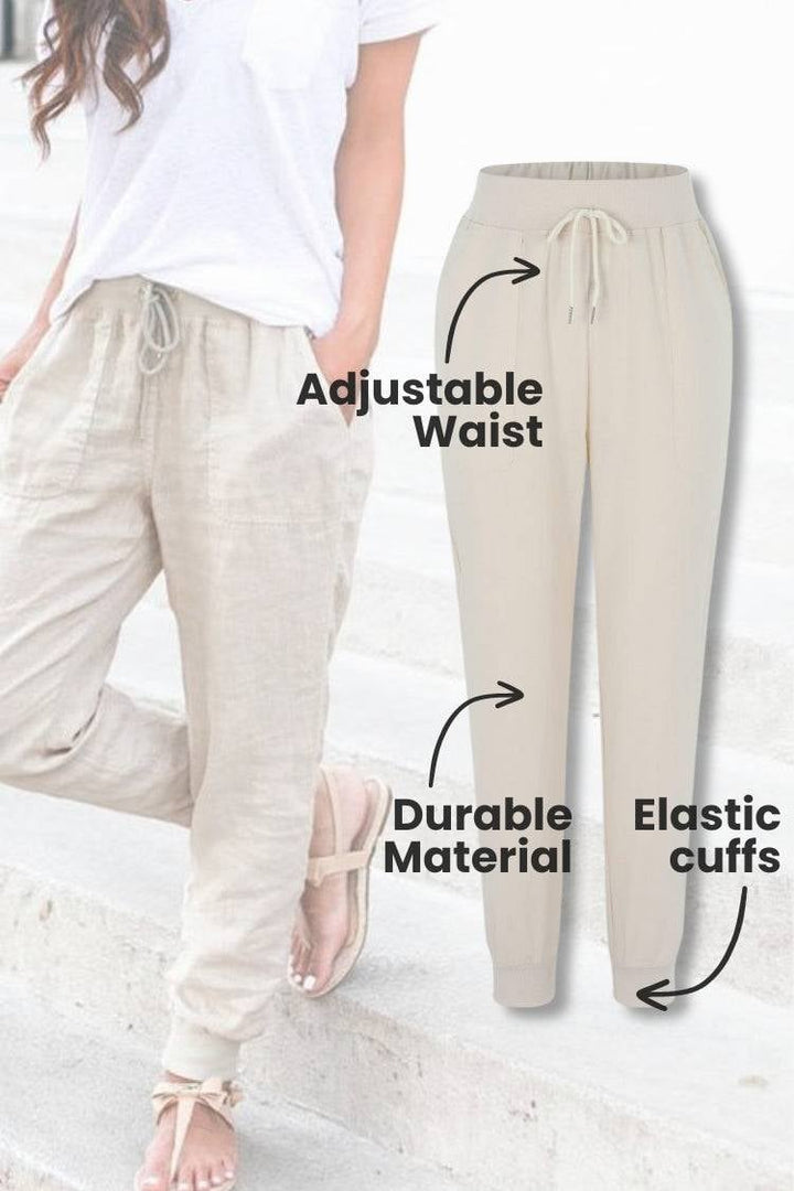 Women's navy blue tapered jogger pants with elastic ankle cuffs, front view