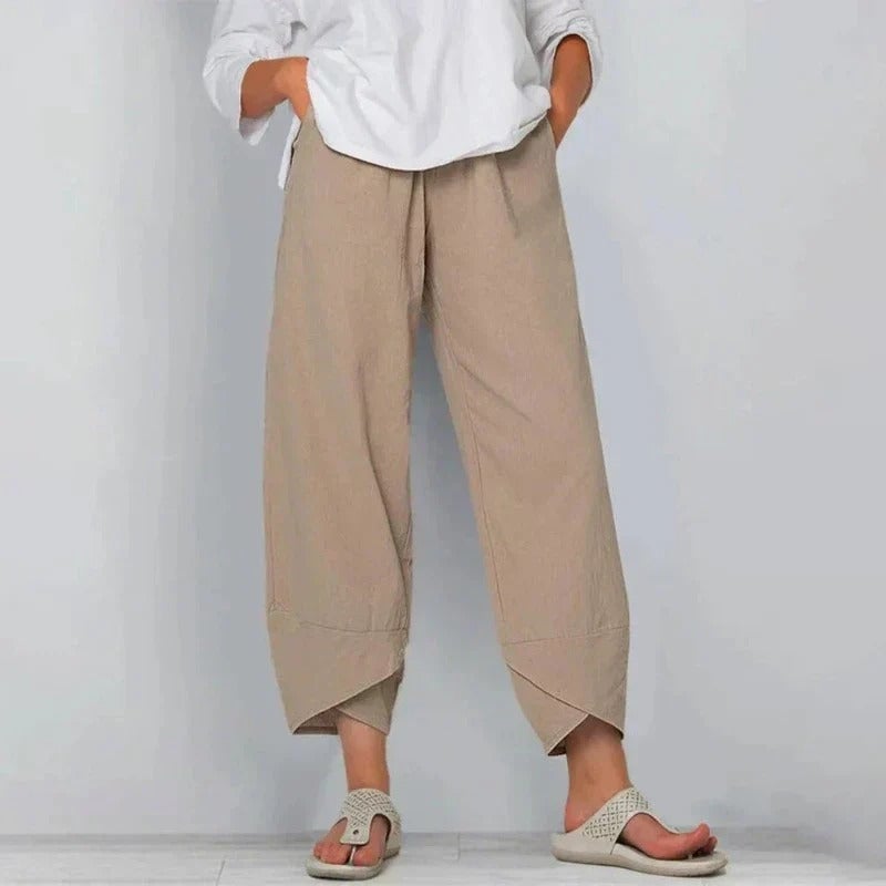 Close-up detail of lightweight breathable fabric on women's tailored summer pants
