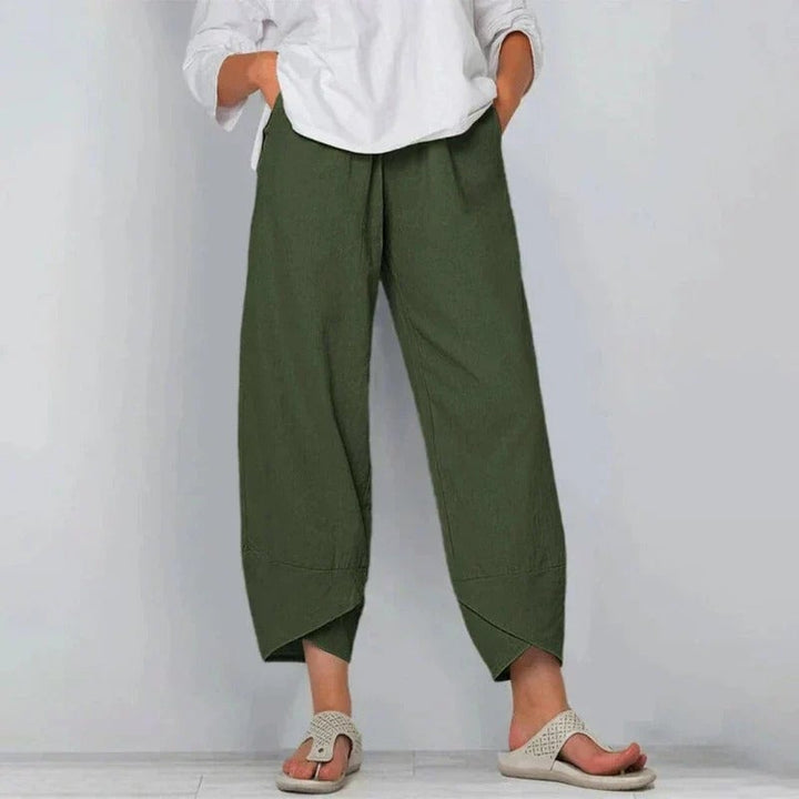 Women's summer pants styled with a casual top, shown in a warm-weather setting