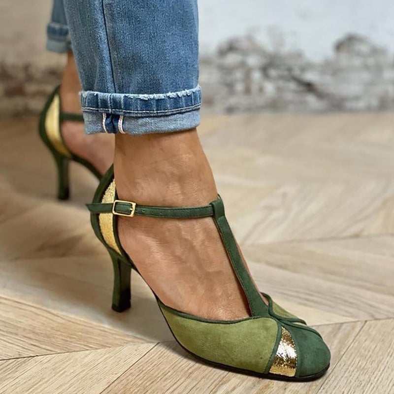 Front view of green patchwork closed toe T-strap heels on a white background