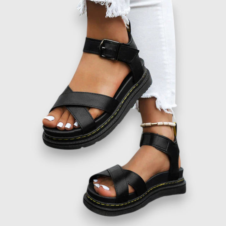 Women's adjustable comfort sandals in black with cushioned footbed and slip-resistant sole, front view