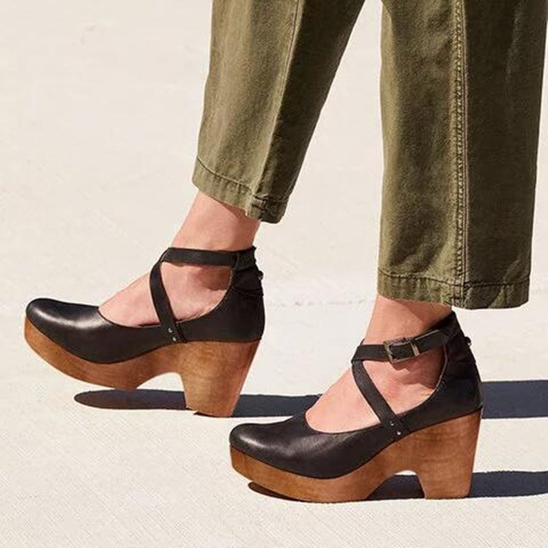 Teresa closed-toe wedge heels with adjustable ankle strap in black, side view