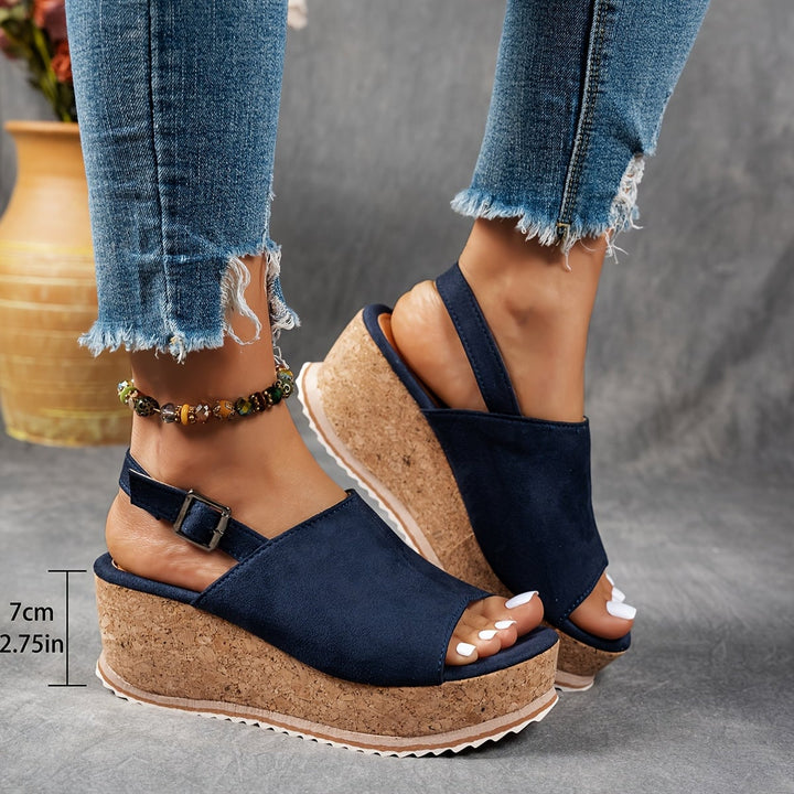 Terra platform sandals in black displayed from the back showing strap and heel construction