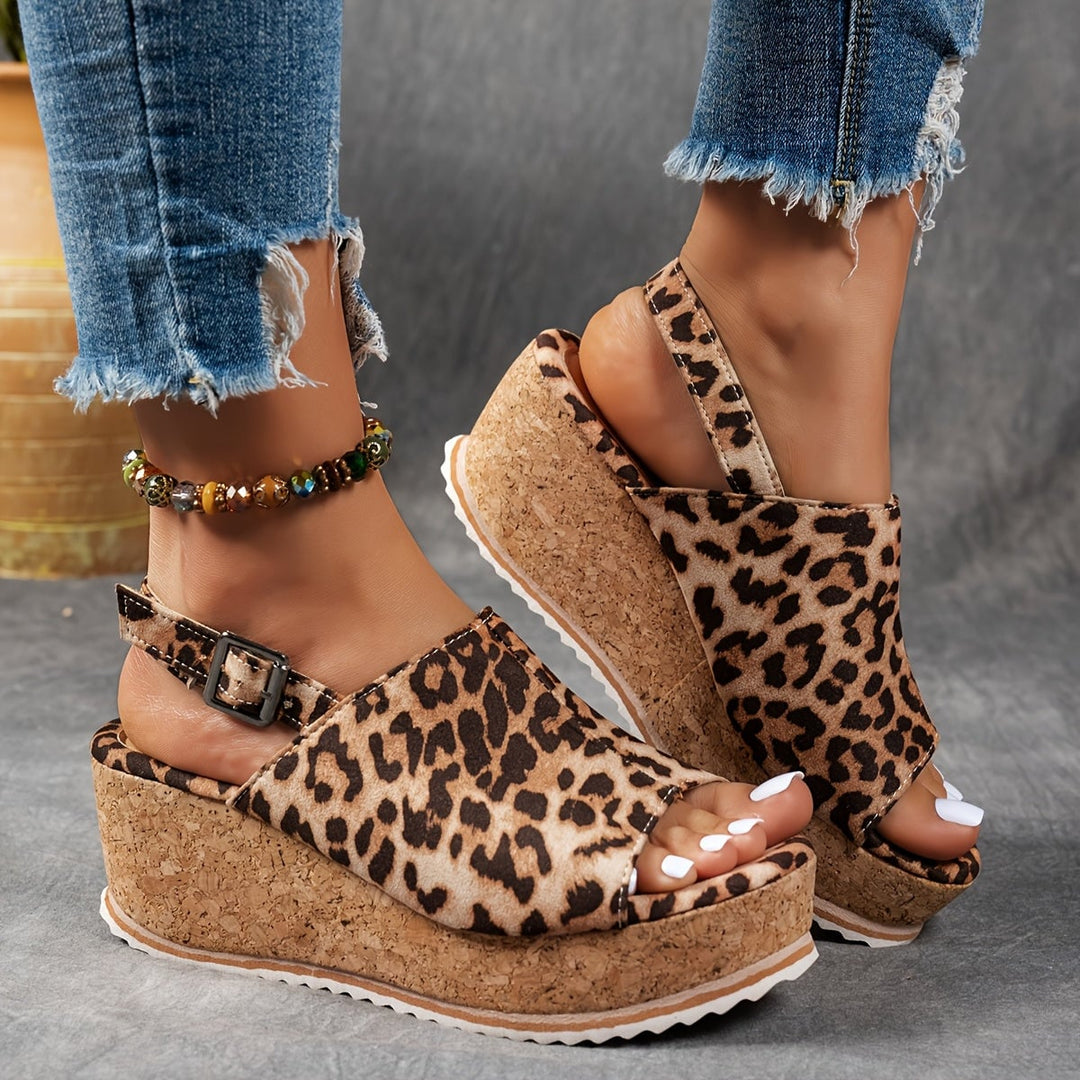 Terra platform sandals in brown leopard print shown from the side showcasing platform lift